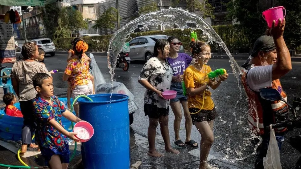 children patrolling with water guns during Songkran