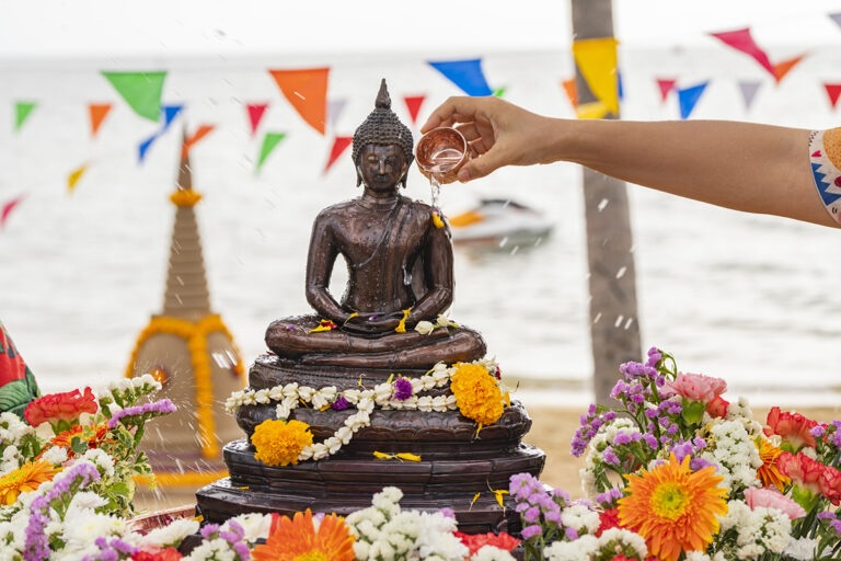 Bathing Buddha image on a beach