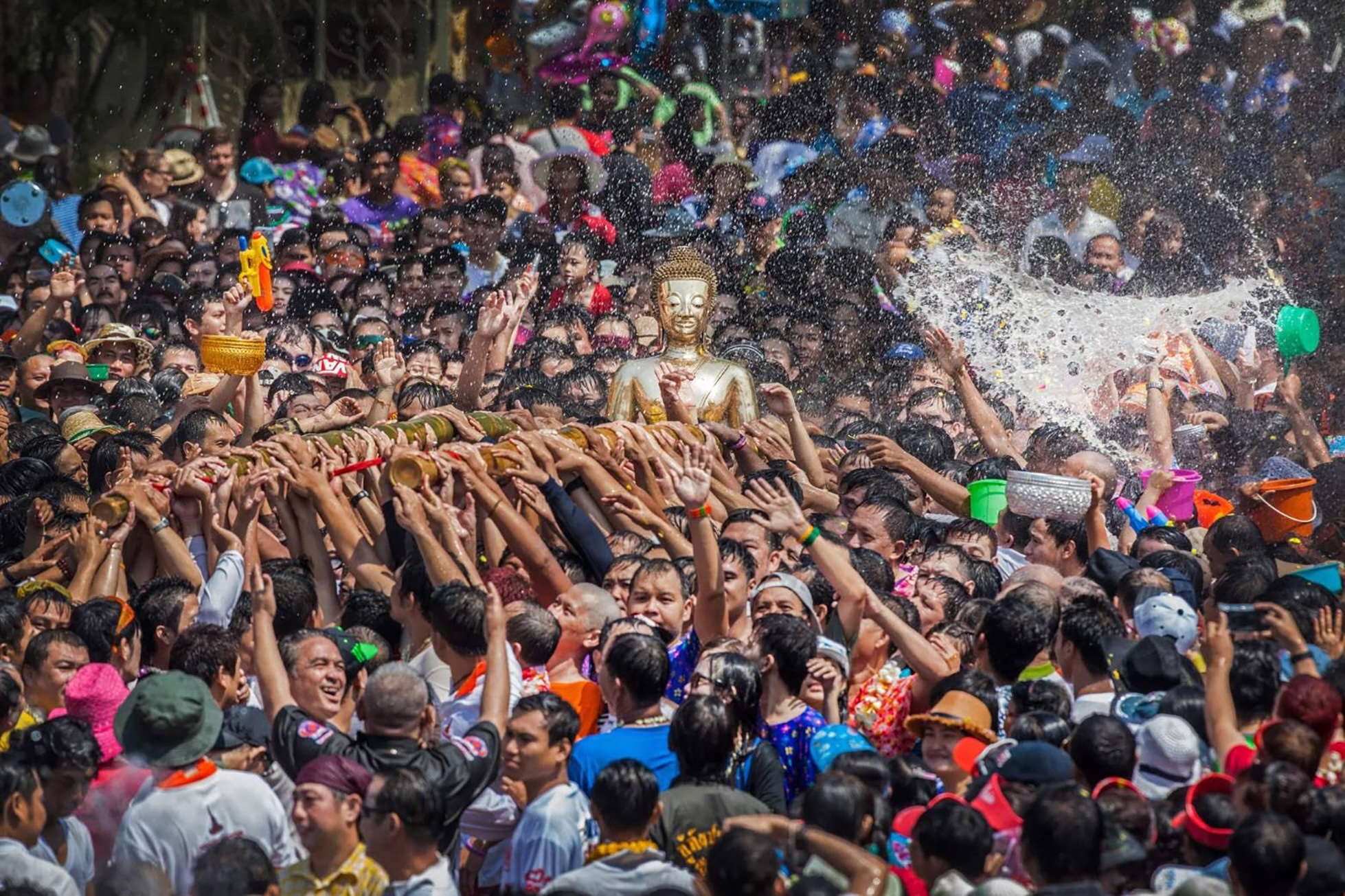 Water Fights in Chiang Mai with Buddha statue